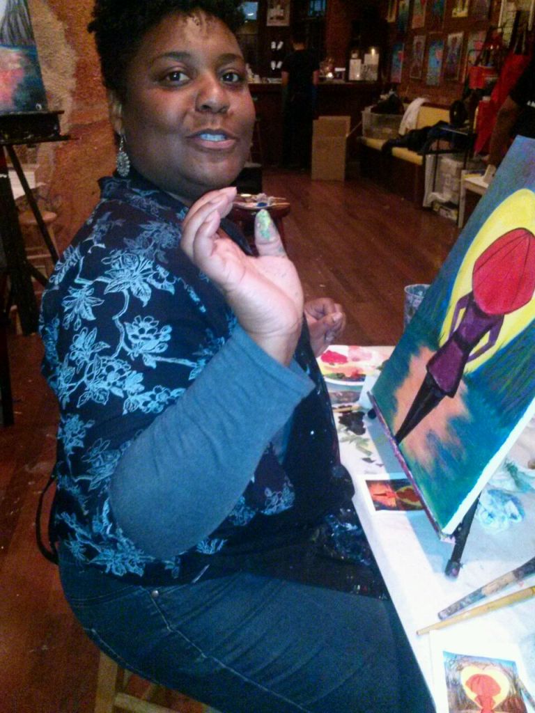 Me talking while painting at the paint and sip event.