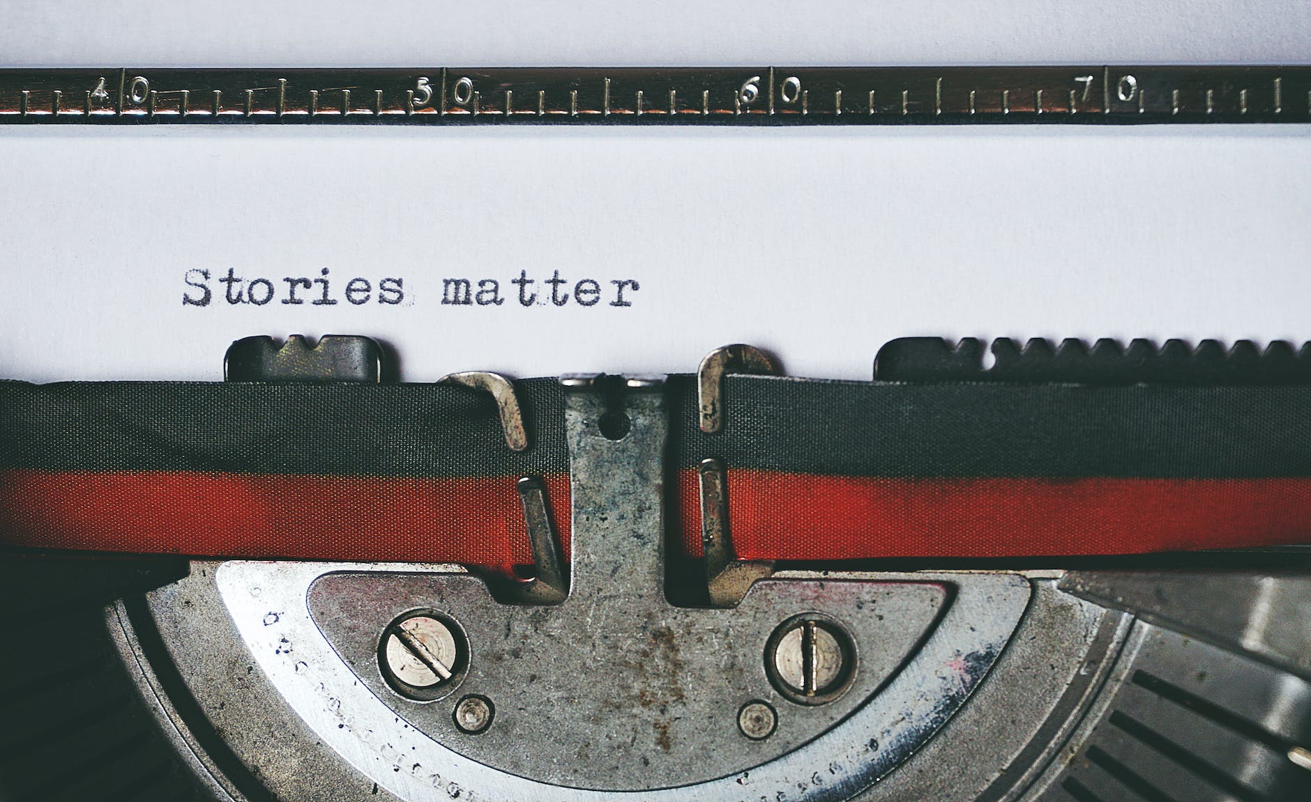Typewriter. text says "Stories matter"